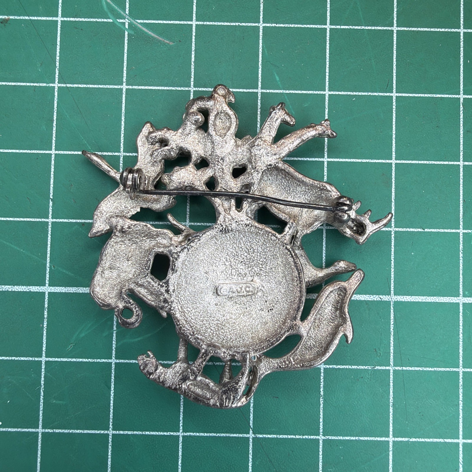 Vintage signed A.J.C. Dark Grey “animals Around The World” Brooch