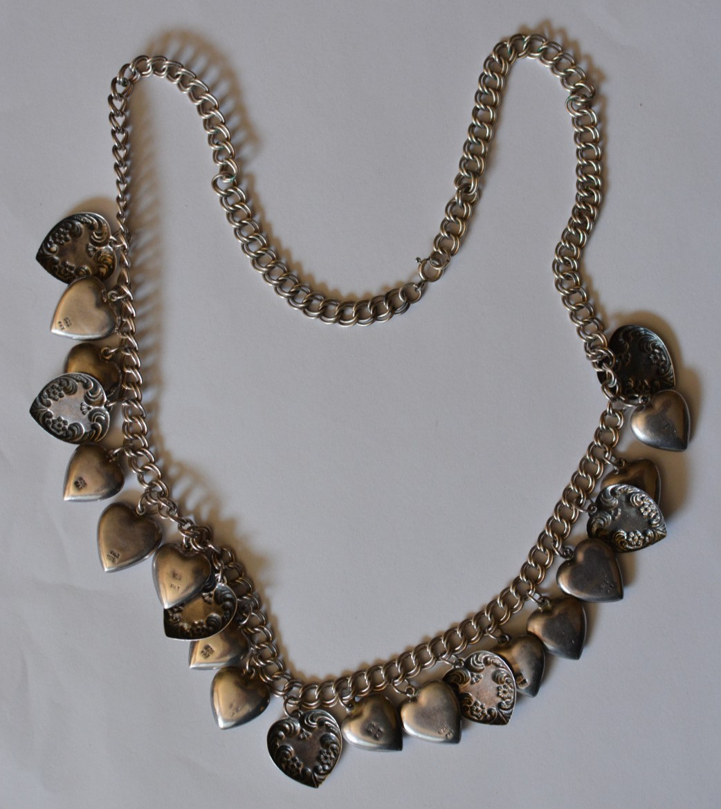 Signed PAJ 925 repousse multiple heart charms necklace 58 grams 24 inches long