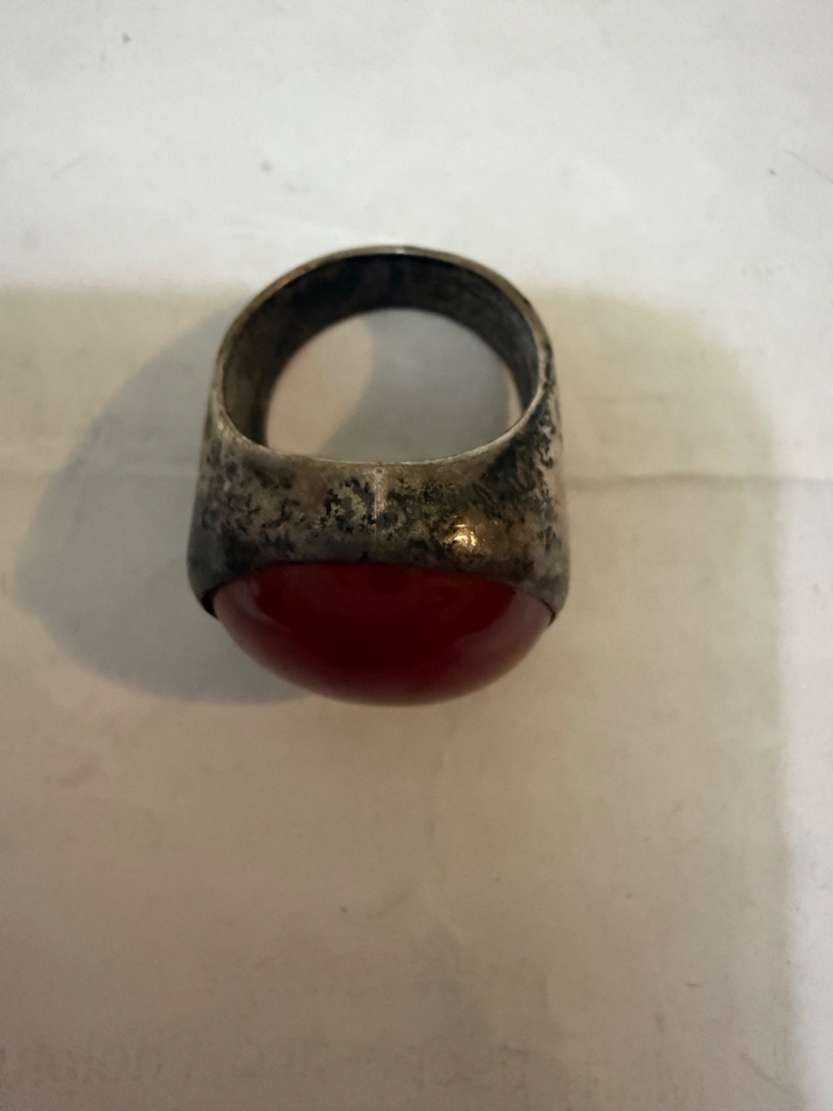 vintage silver dome-style cocktail ring featuring a prominent, smooth red caboch