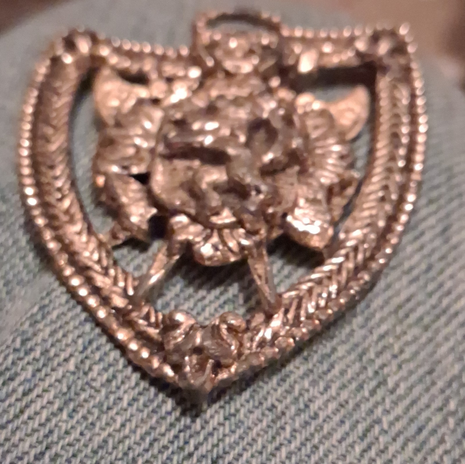 Silver Tone Shield Pin with Raised Animal Head Design, No Stone