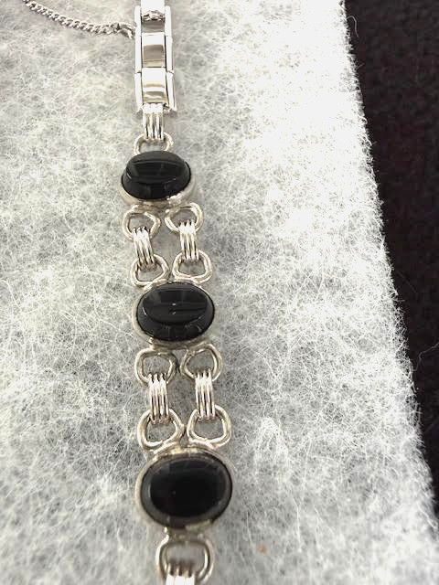 ADMARK, NEW OLD STOCK, SIX ONYX BRACELET WITH SAFETY CHAIN 12K GOLD FILLED ADM60