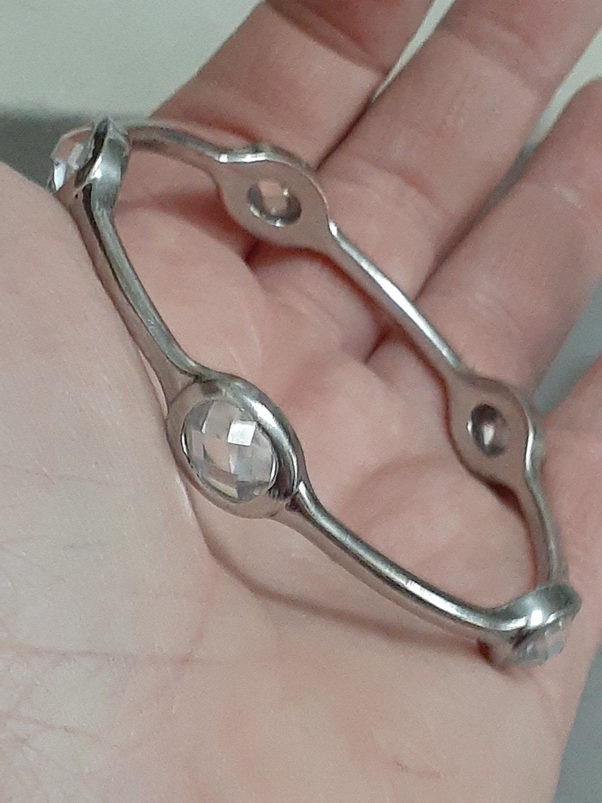 Fauceted crystal accent bangle bracelet Silvertone bezel set stones