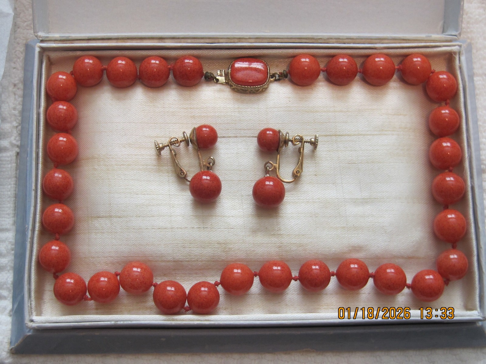 Marvella Coral color necklace & screw back earrings with blue Marvella box