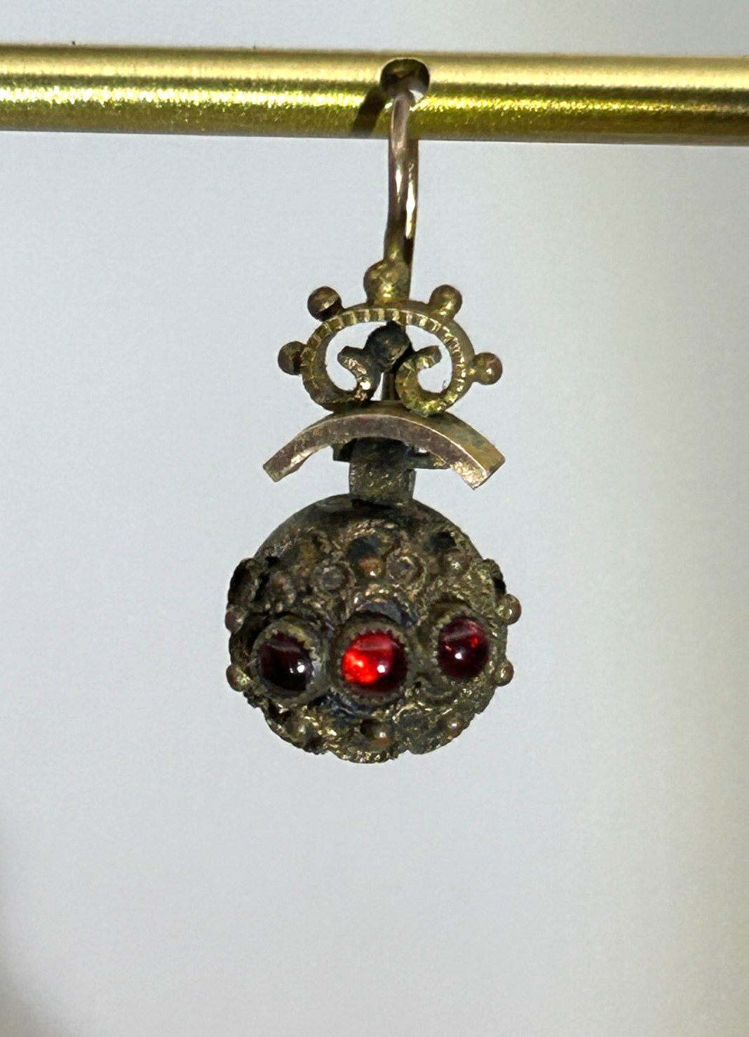 Victorian Era Circa 1880’s single dangle earring with pacer garnets.