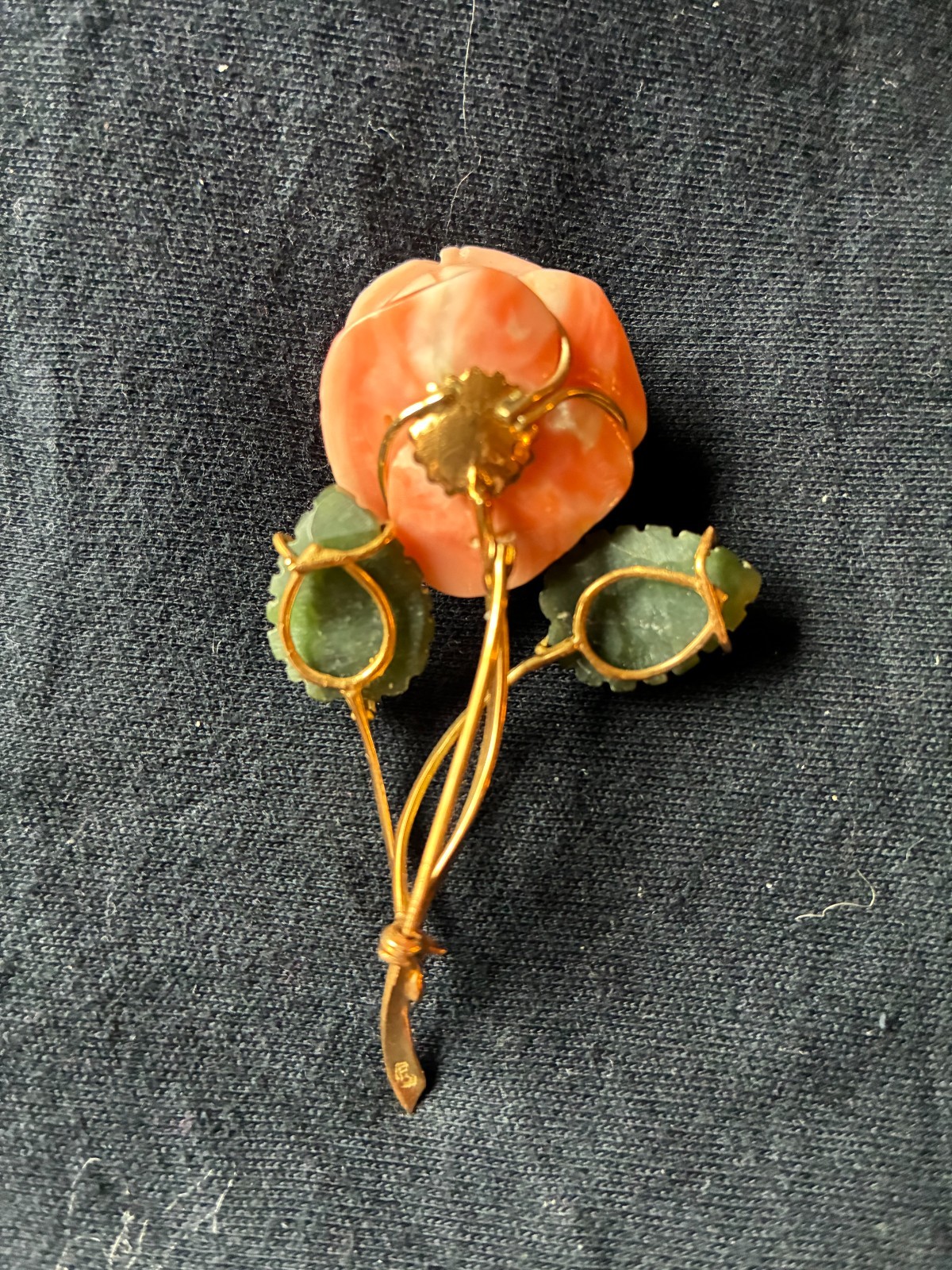 Charming rose-shaped coral pin with enamel leaves