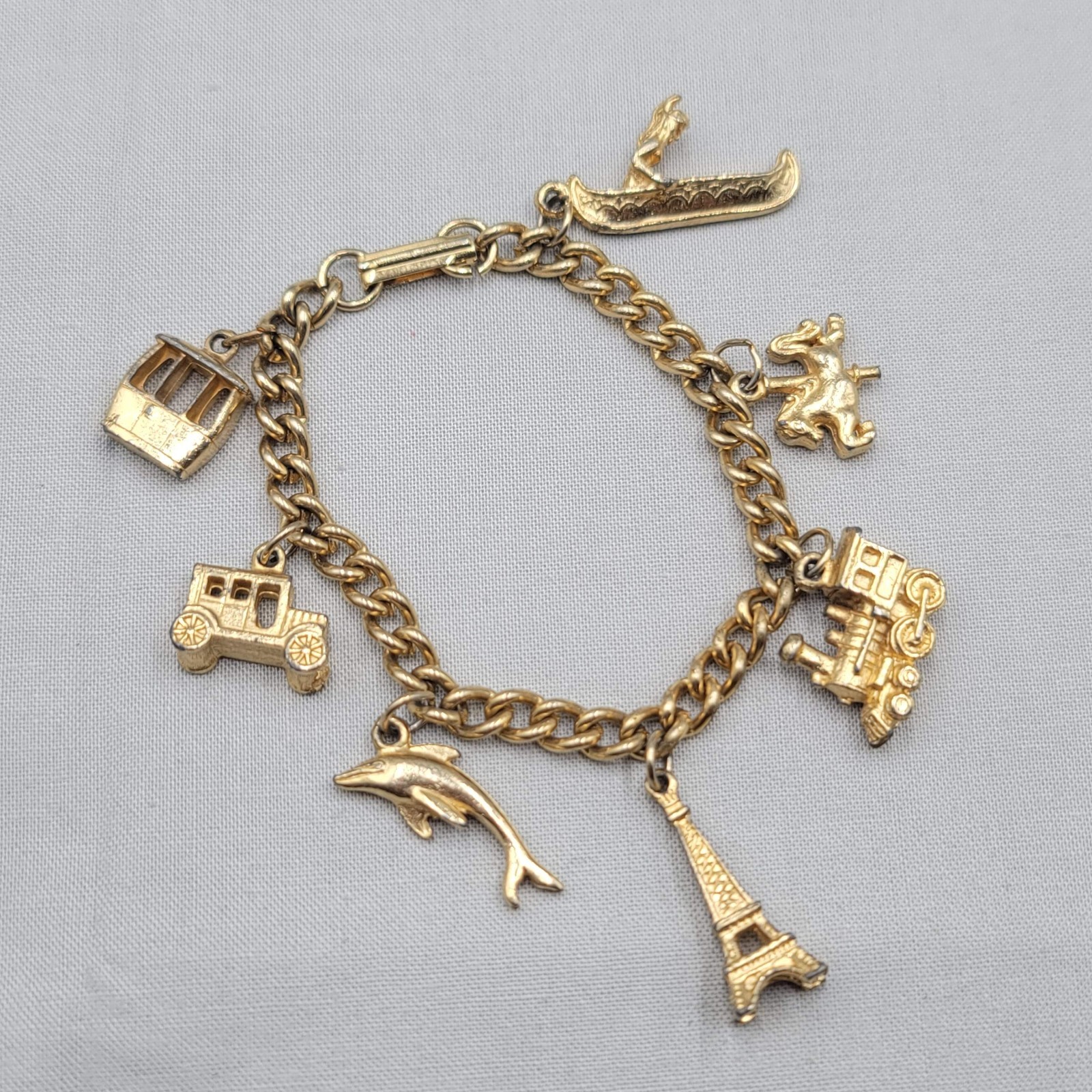 Vintage Charm Bracelet Gold tone Estate Costume 7 Dangle Charms 6.5″