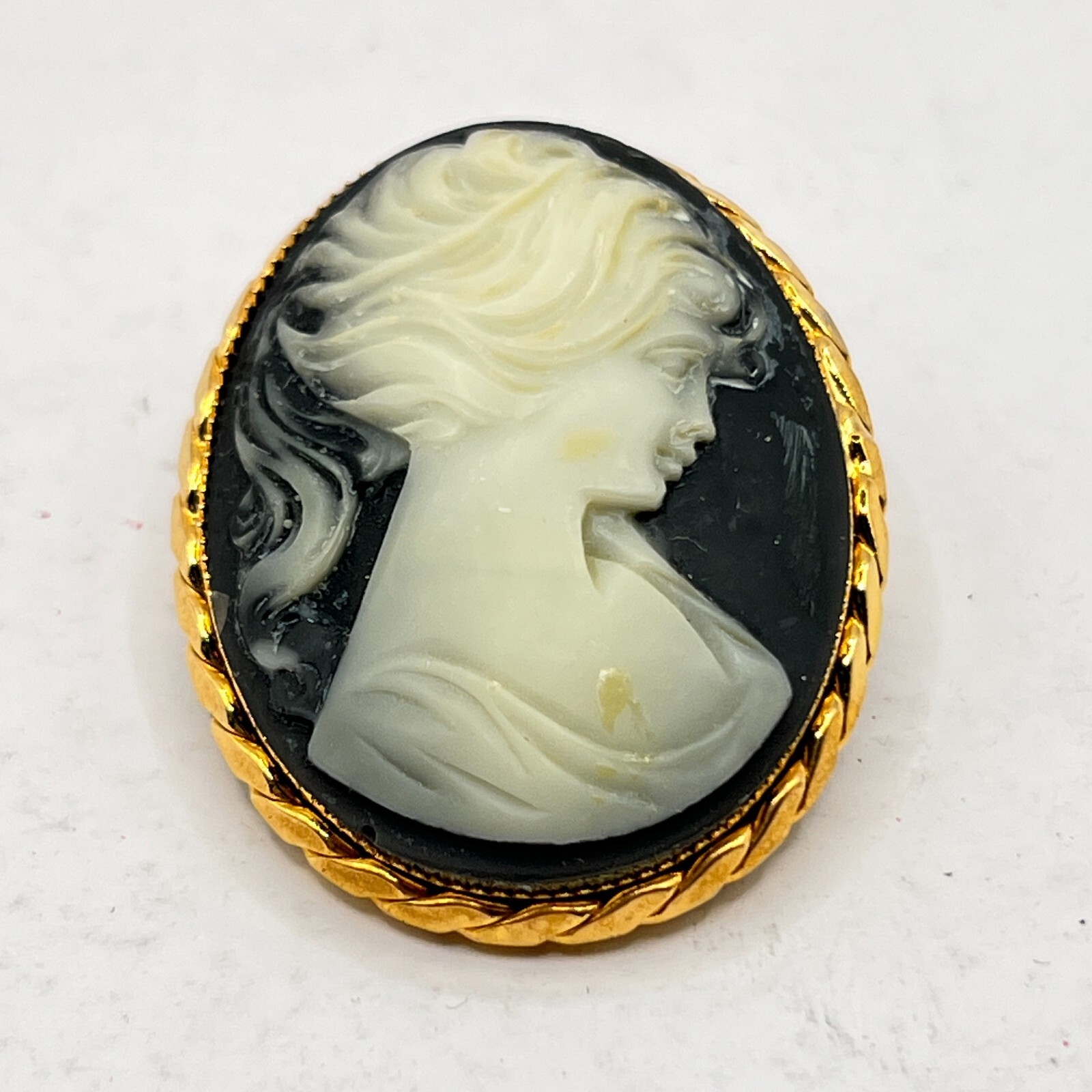 Gold Tone Cameo Brooch Oval Blue background – 1 5/8″ x 1 3/8″