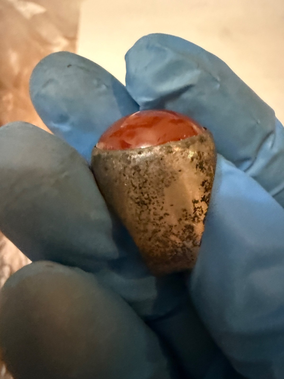 vintage silver dome-style cocktail ring featuring a prominent, smooth red caboch