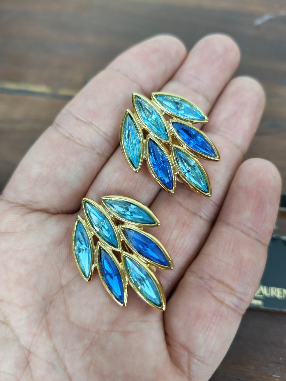 Yves Saint Laurent gold plated earrings, set with light blue and blue crystals