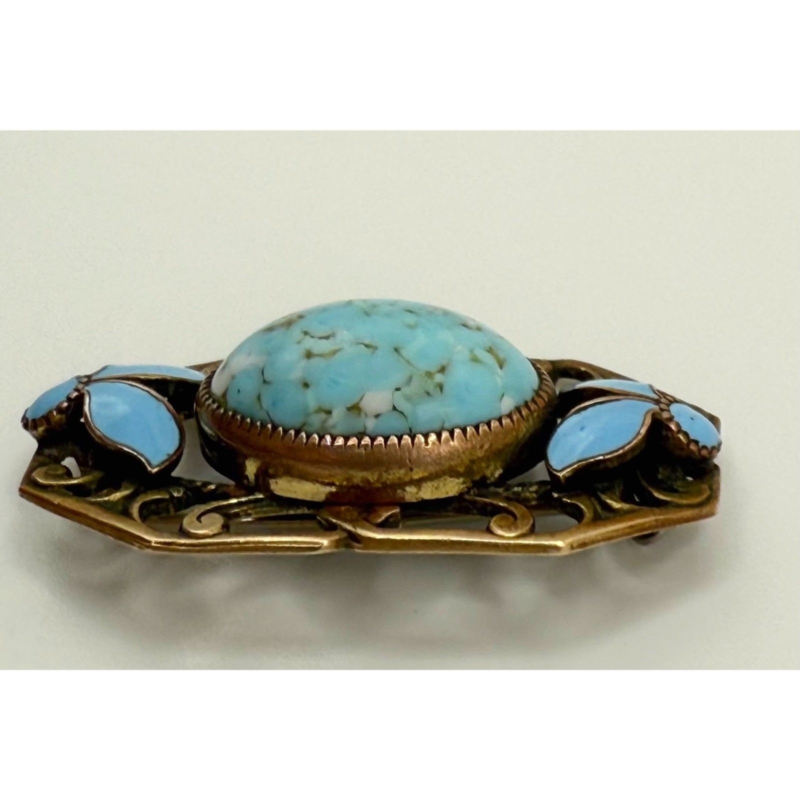 Turquoise brass brooch vintage source unknown
