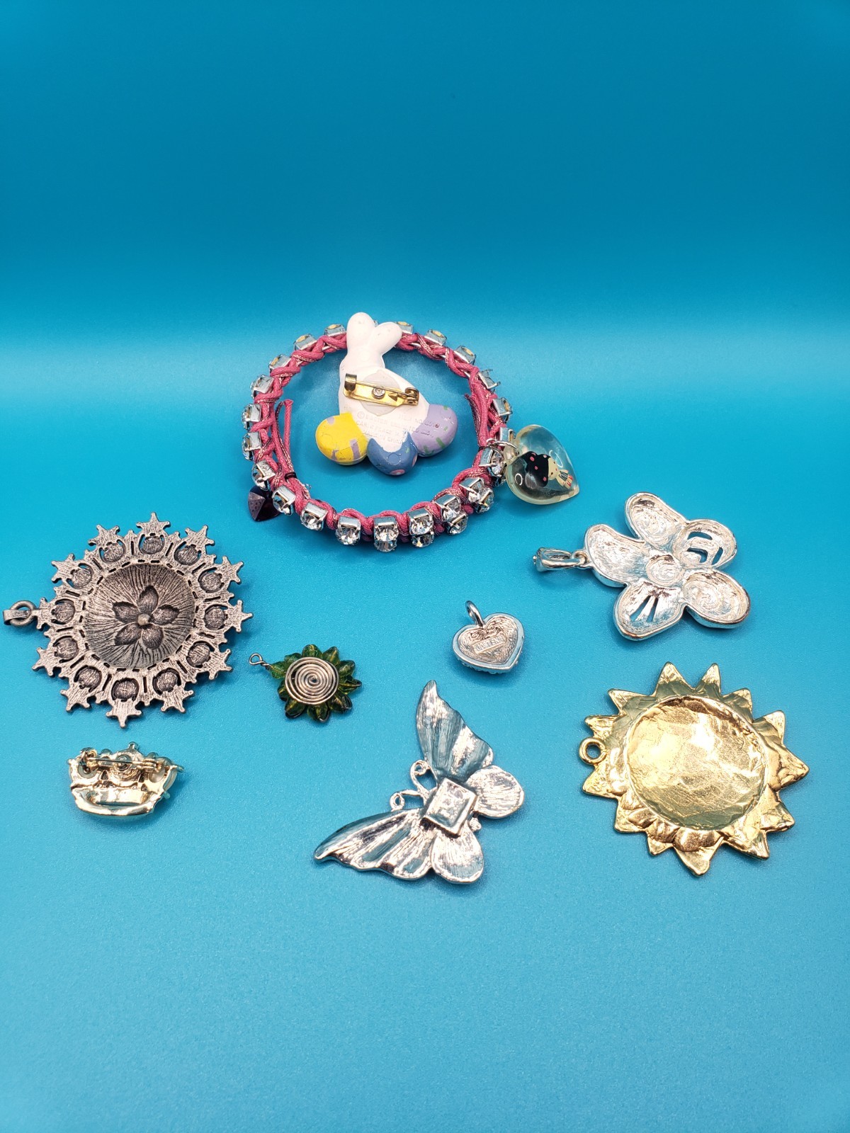Mixed Costume Jewelry Lot: Pendants, Brooches, Rhinestone Bracelet & More