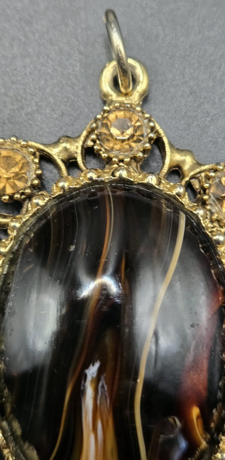 Vintage Ornate Gold Tone Oval Pendant Brown Black Stone Decorative Accents