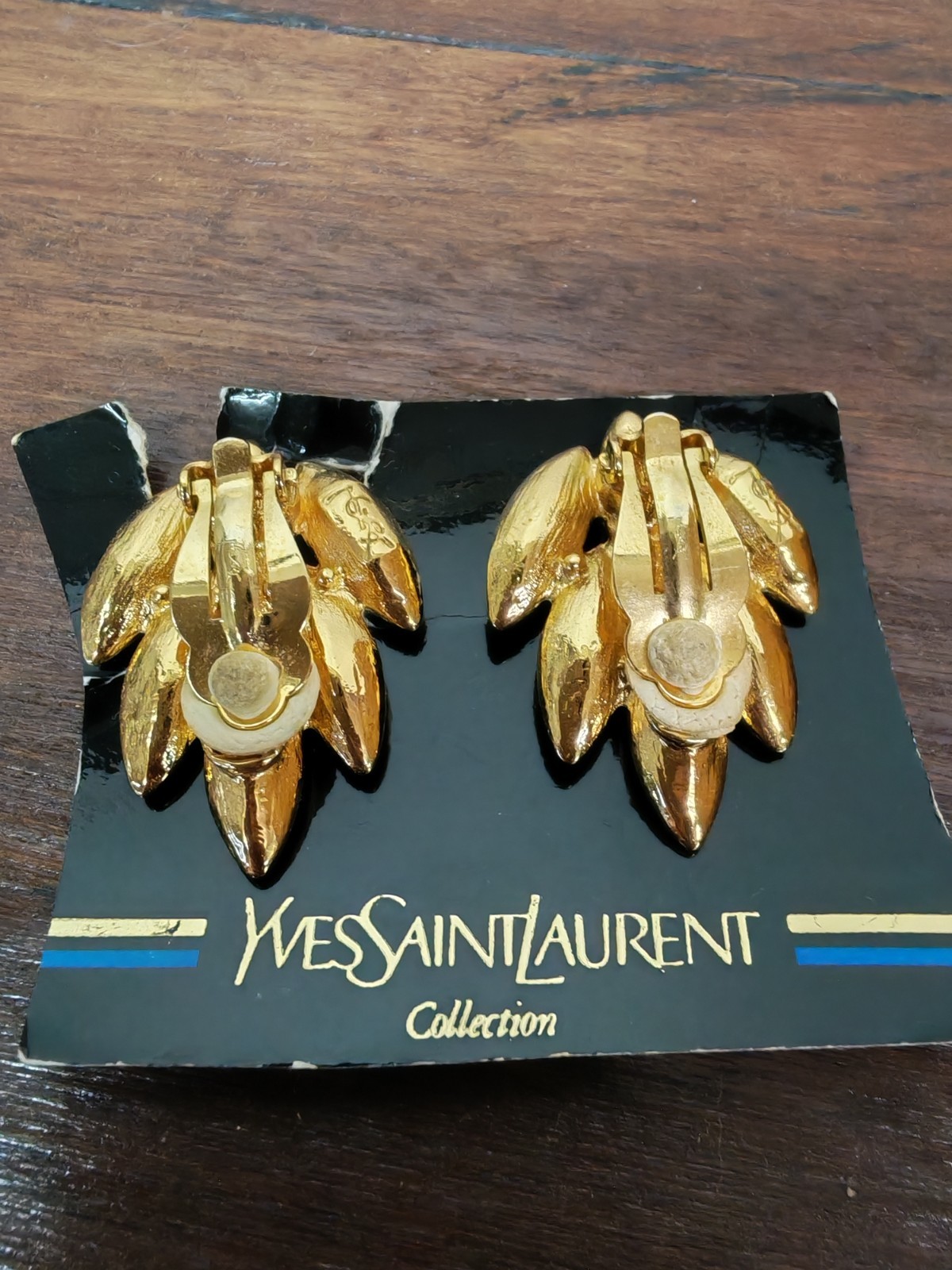 Yves Saint Laurent gold plated earrings, set with light blue and blue crystals