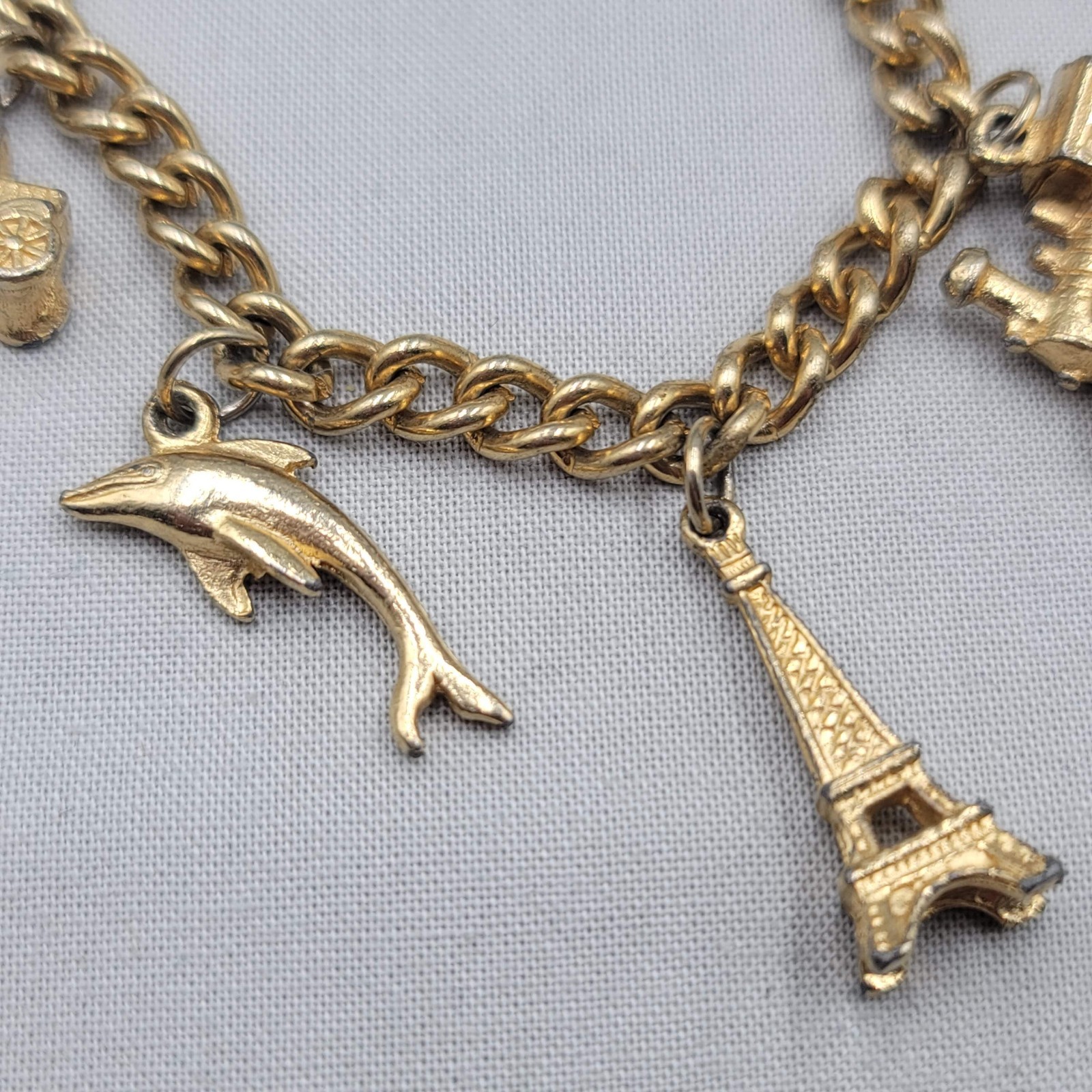 Vintage Charm Bracelet Gold tone Estate Costume 7 Dangle Charms 6.5″