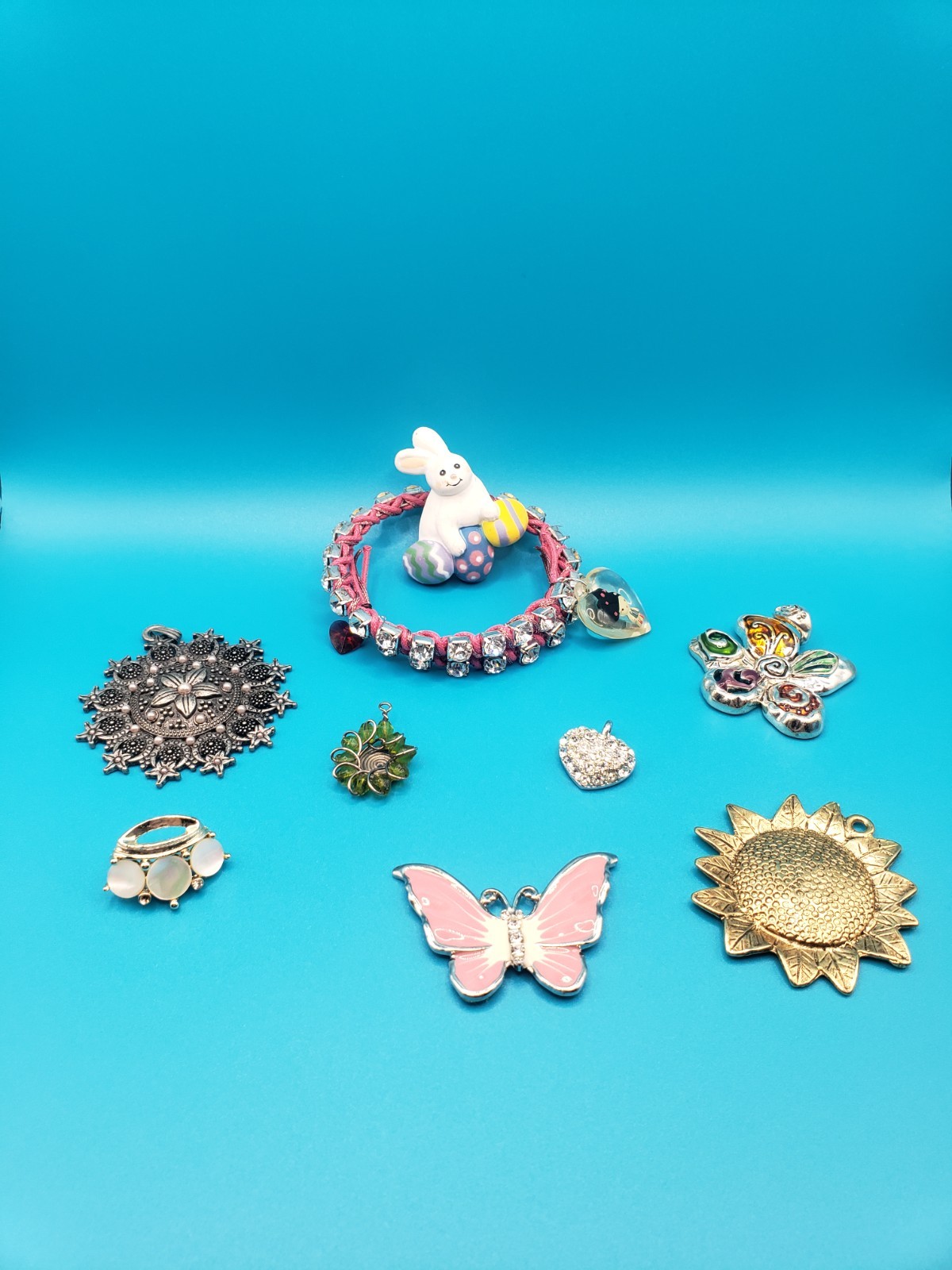 Mixed Costume Jewelry Lot: Pendants, Brooches, Rhinestone Bracelet & More