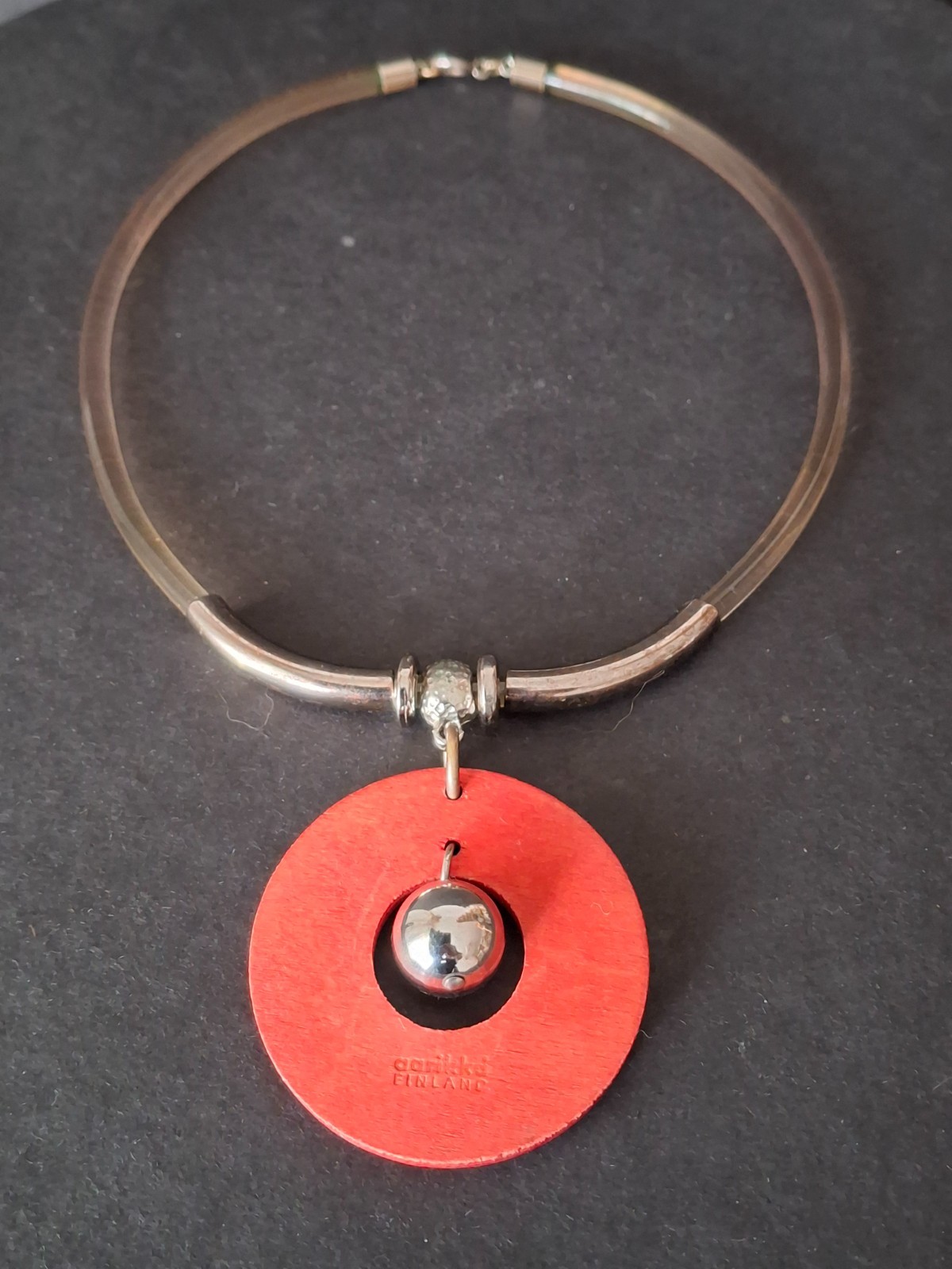 Aarikka Finland necklace with a vibrant red wooden ring pendant