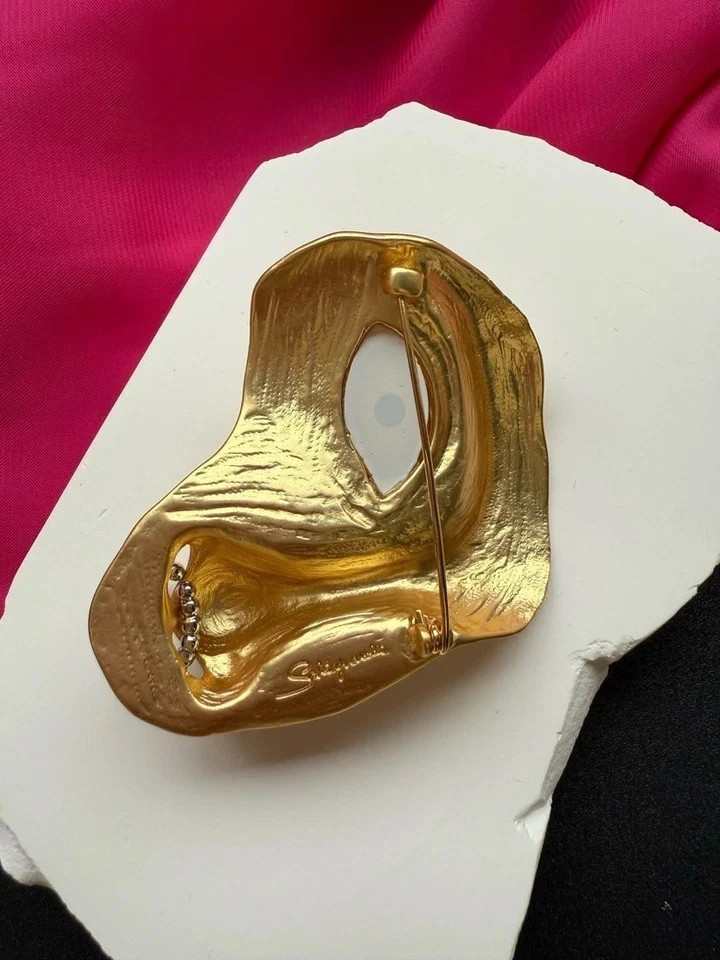 Schiaparelli yellow eye nose brooch with box