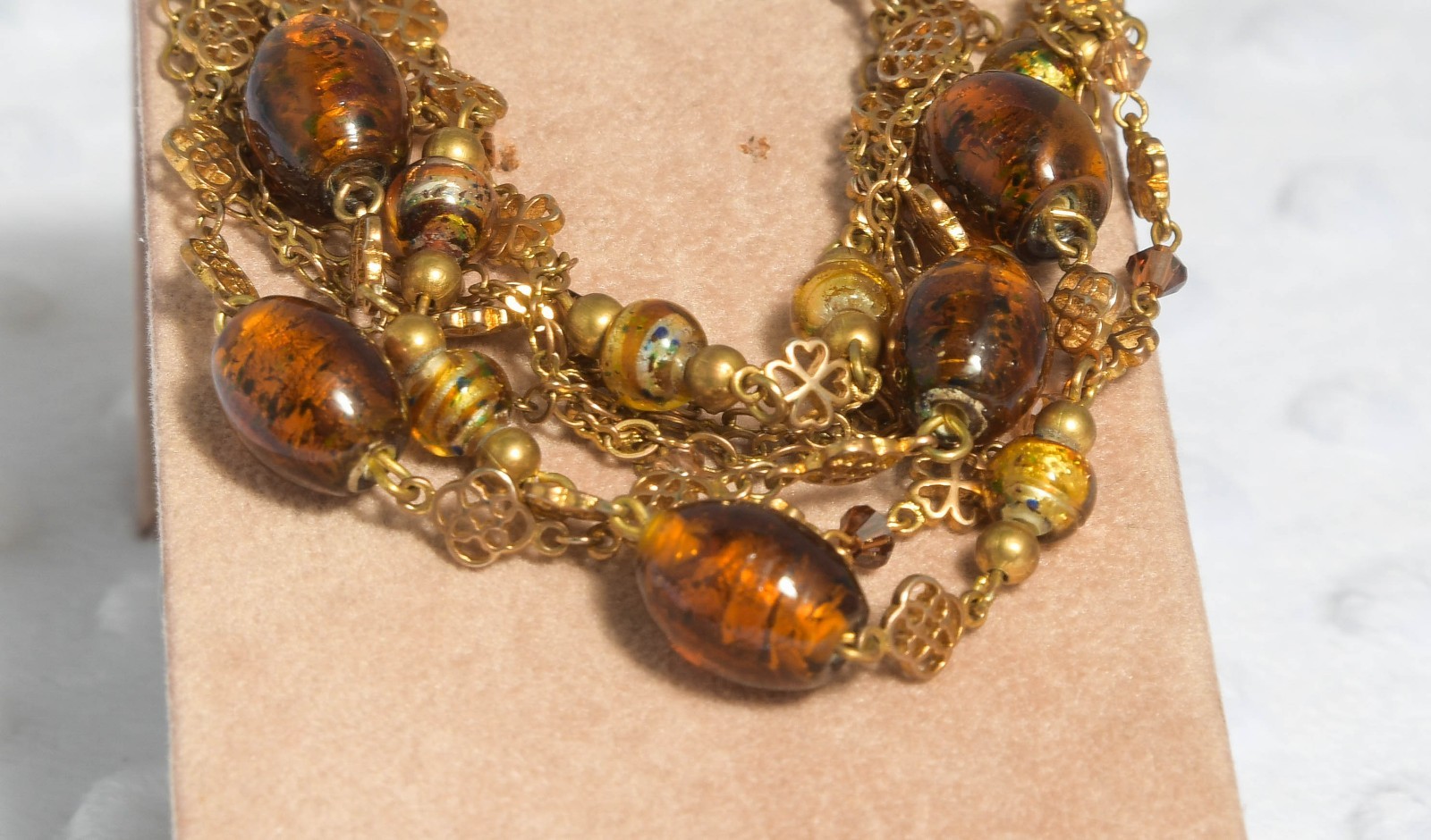 Vintage brass toned 7 strand toggle bracelet with Venetian foil type beading