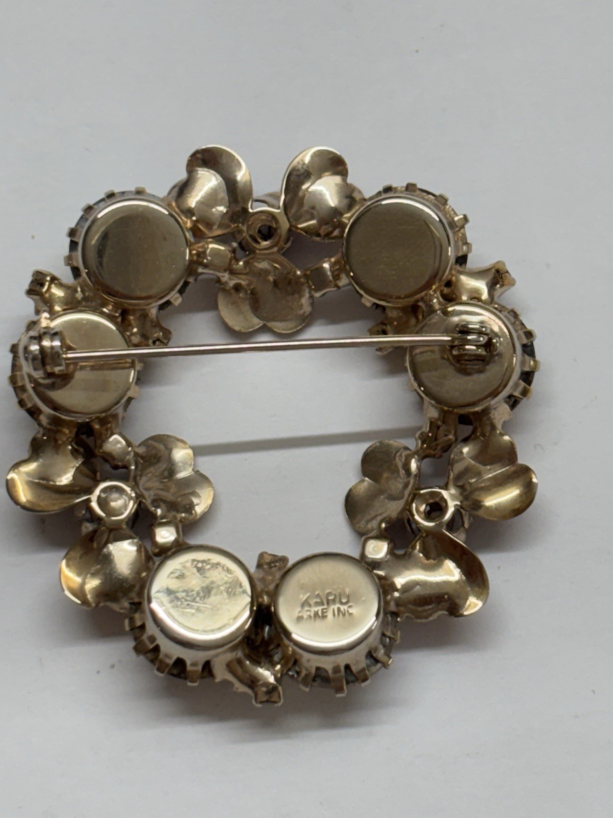 KARU ARKEING floral and amber pin