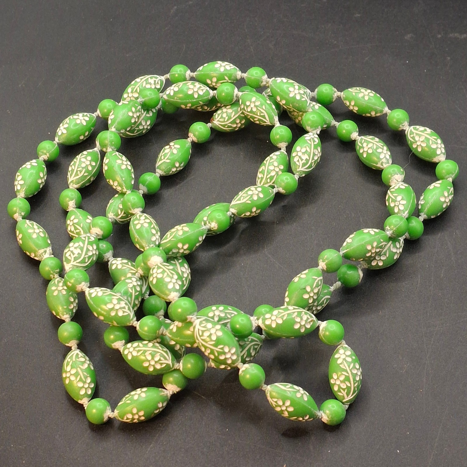 Vintage 44″ Long Grass Green & White Floral Barrel Plastic Bead Necklace