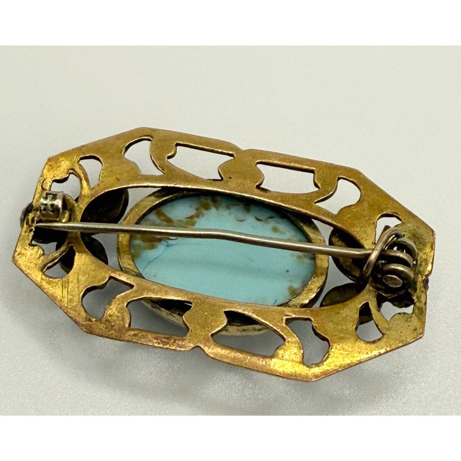 Turquoise brass brooch vintage source unknown