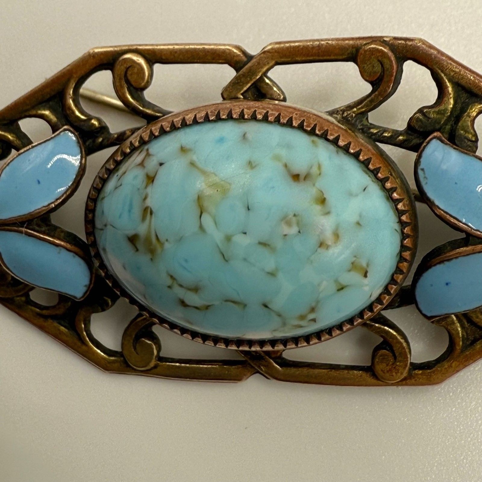 Turquoise brass brooch vintage source unknown