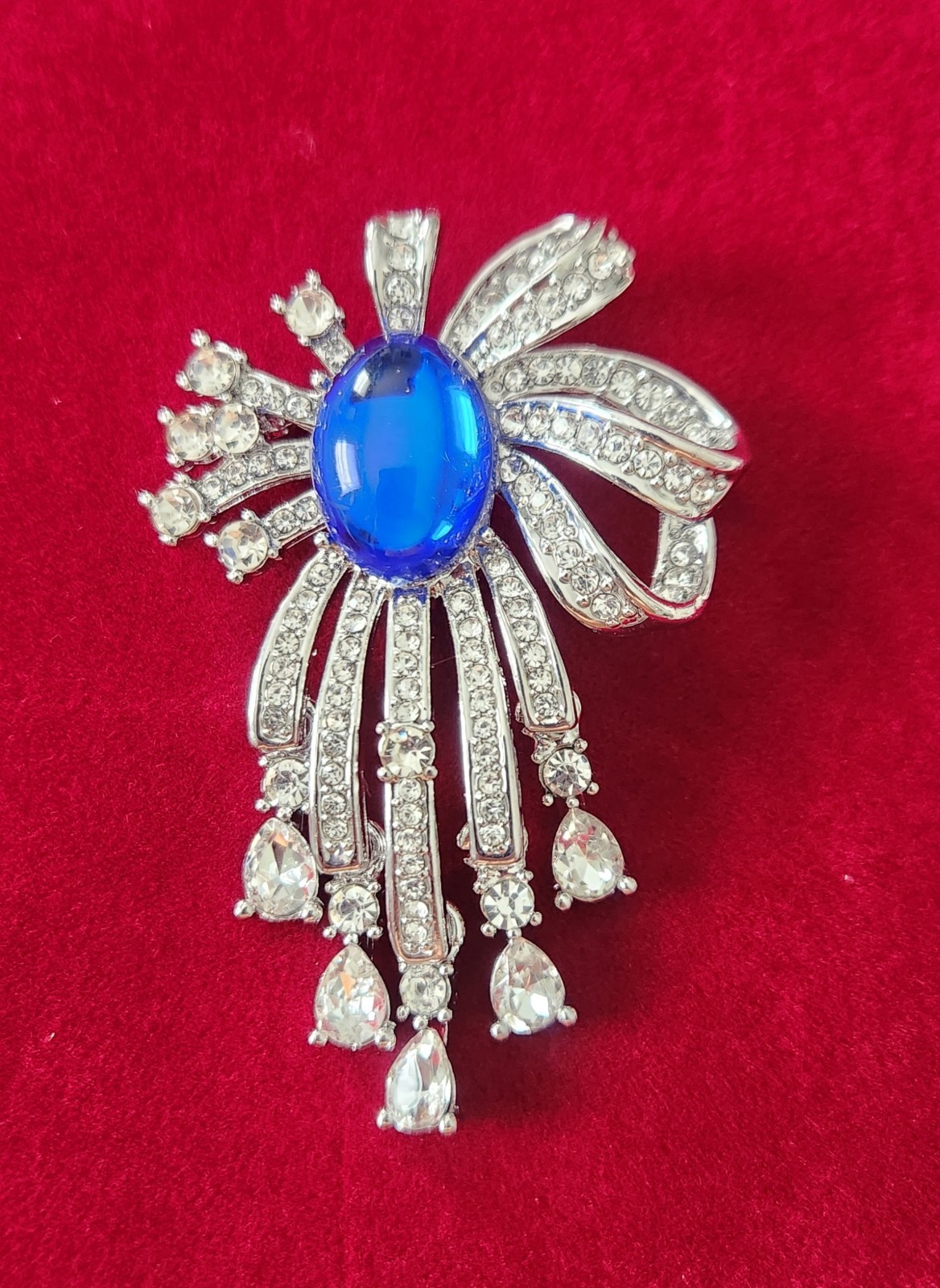 Designer Inspired Dangling Ribbons Brooch With Blue Cabachon Stone