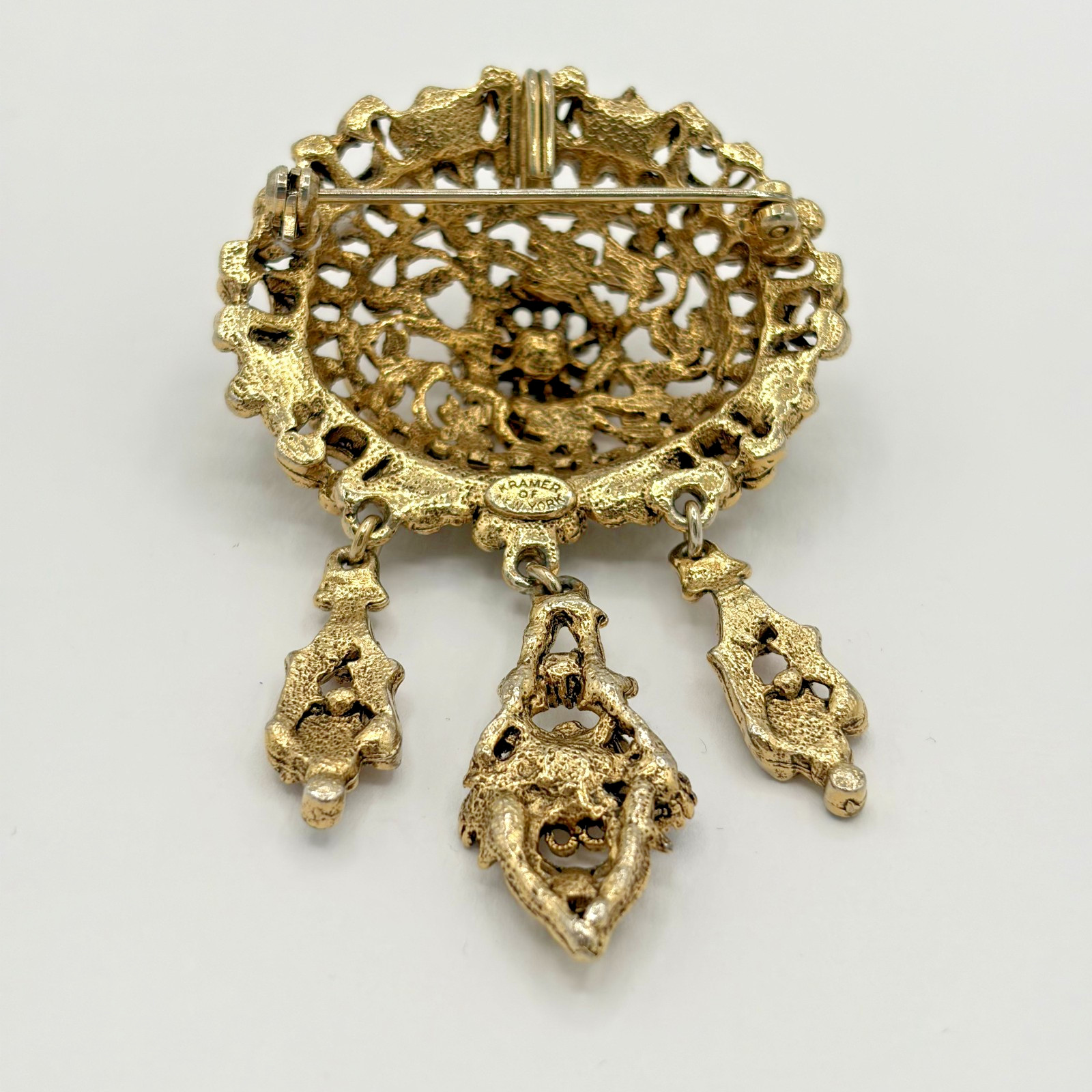 Vintage Kramer of New York Gold Tone Purple Rhinestone Dangle Brooch READ