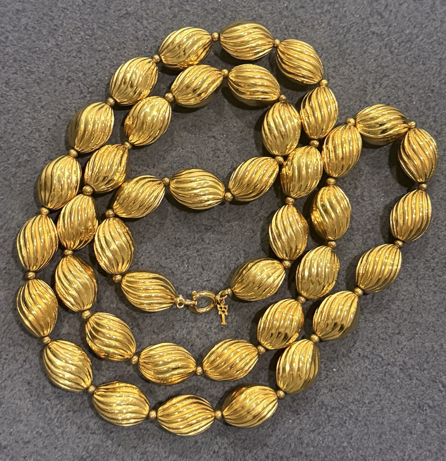 Signed Crown Trifari Vintage Gold Tone Ribbed Oval Bead Opera Long Necklace