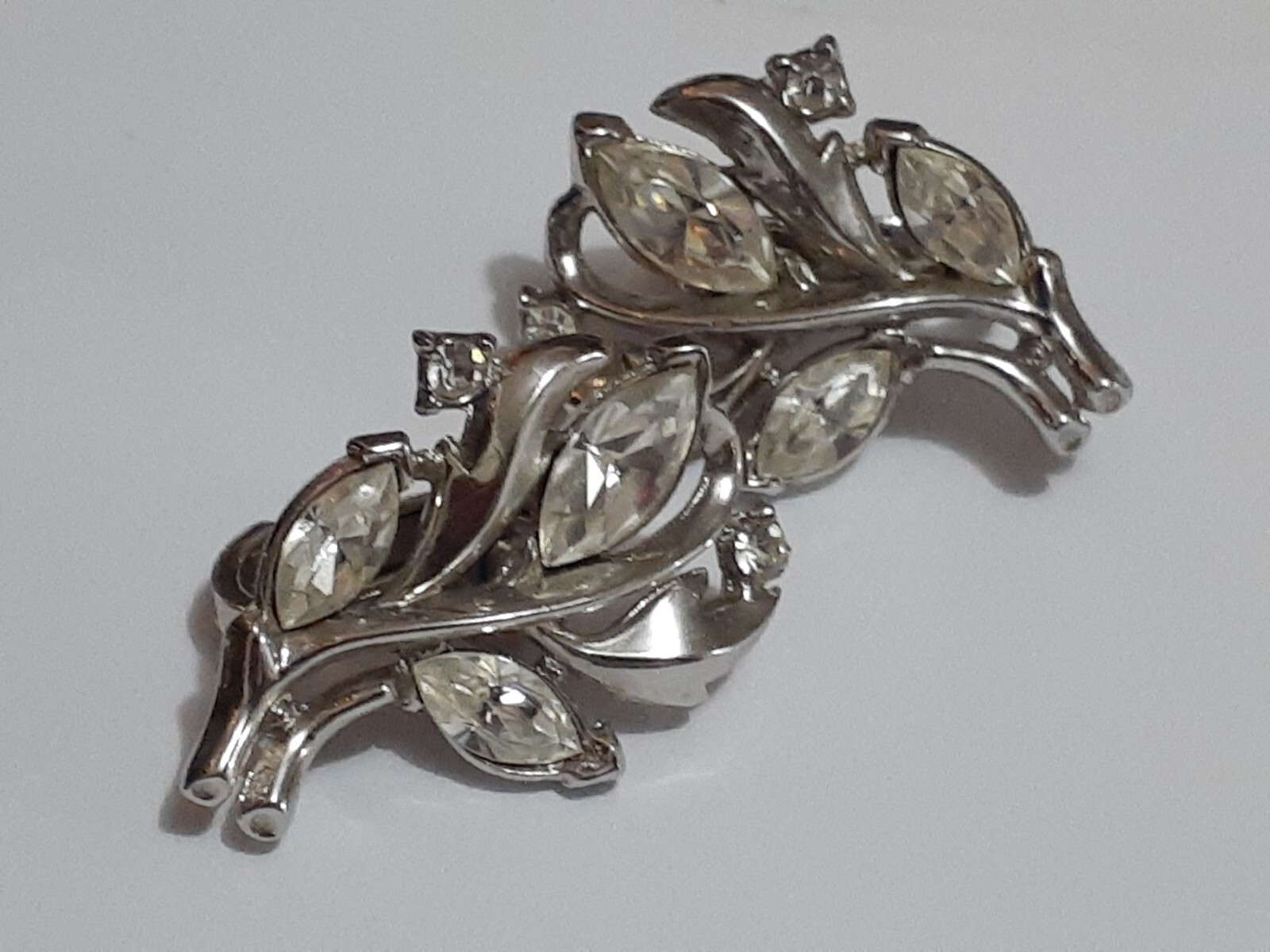 Vintage Crown Trifari rhodium plated marquise cut rhinestone clip on earrings