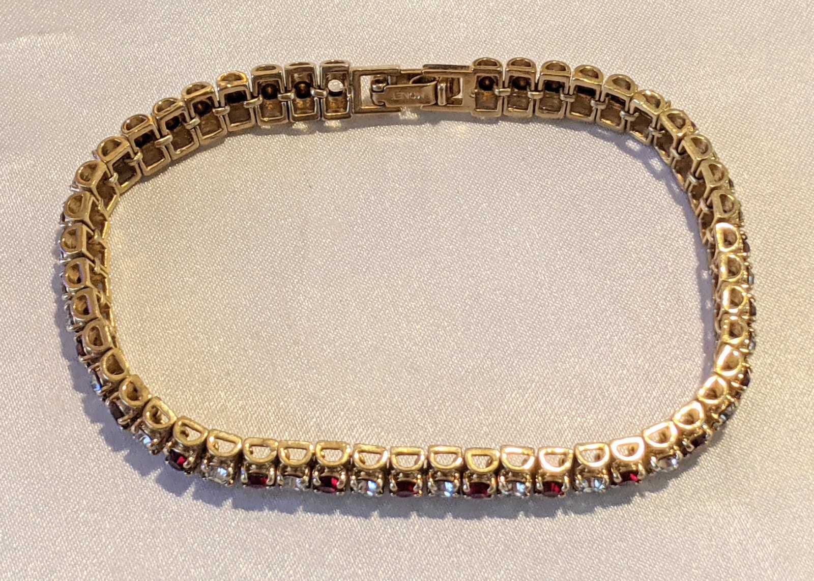 Vintage MONET Ruby Red & Clear Rhinestones Gold Tone Tennis Bracelet Signed 7″