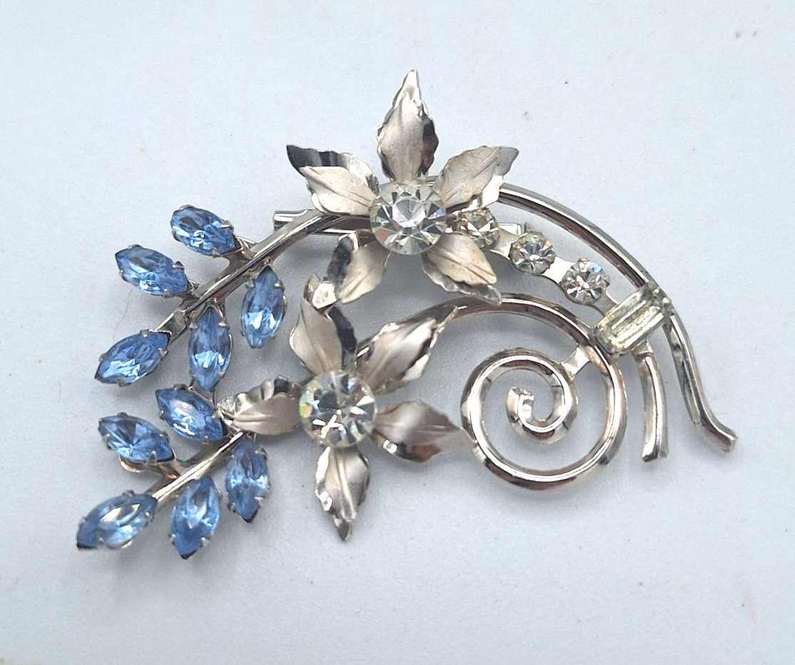 Unsigned Bugbee & Niles? Silver Tone Floral Spray Clear and Blue Flower Brooch