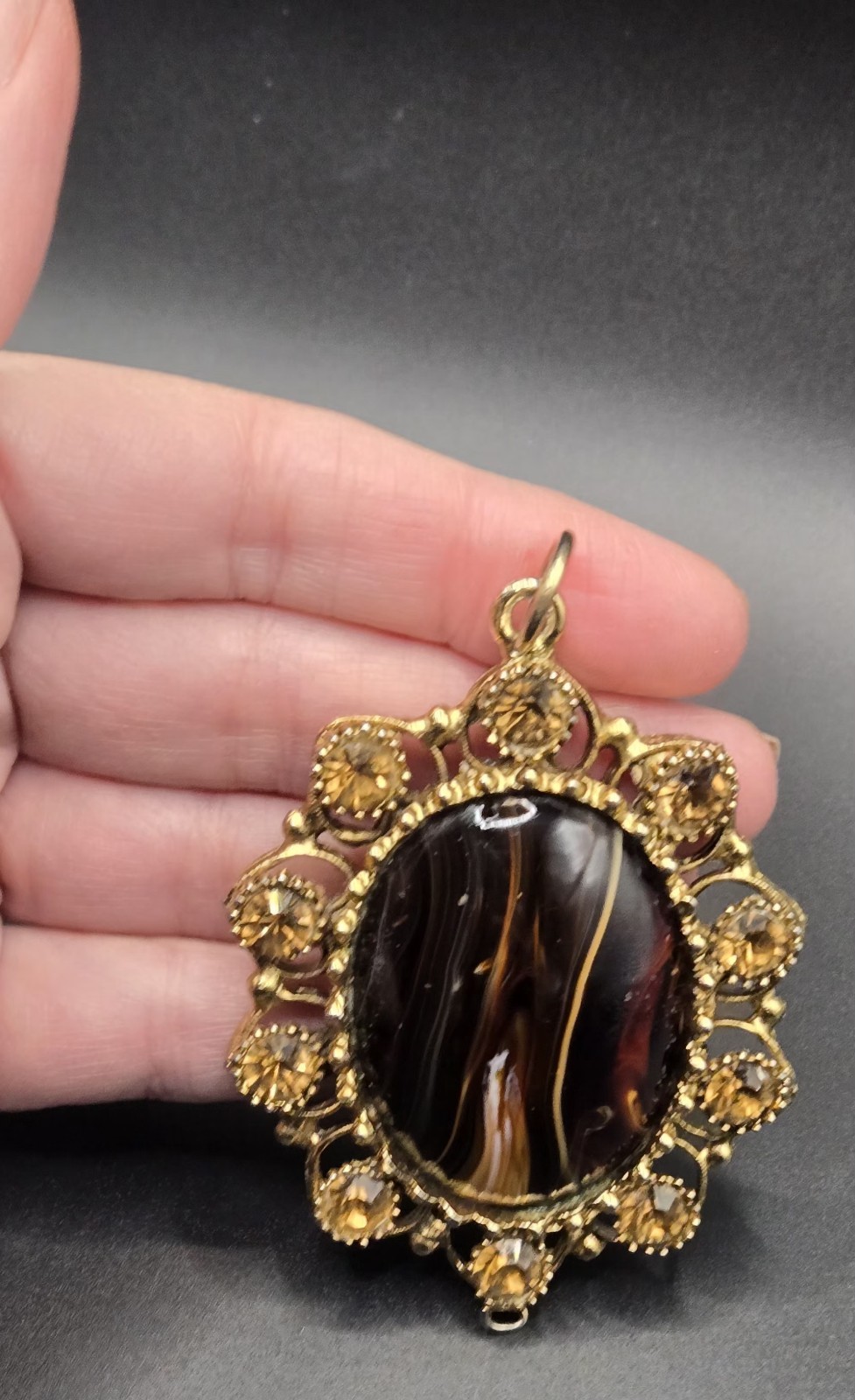 Vintage Ornate Gold Tone Oval Pendant Brown Black Stone Decorative Accents