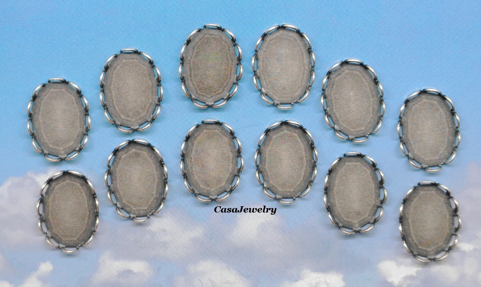 #1156 ANTIQUED .925 STERLING SILVER PLATED LACE BORDER 14x10mm BEZEL – 12 pcs