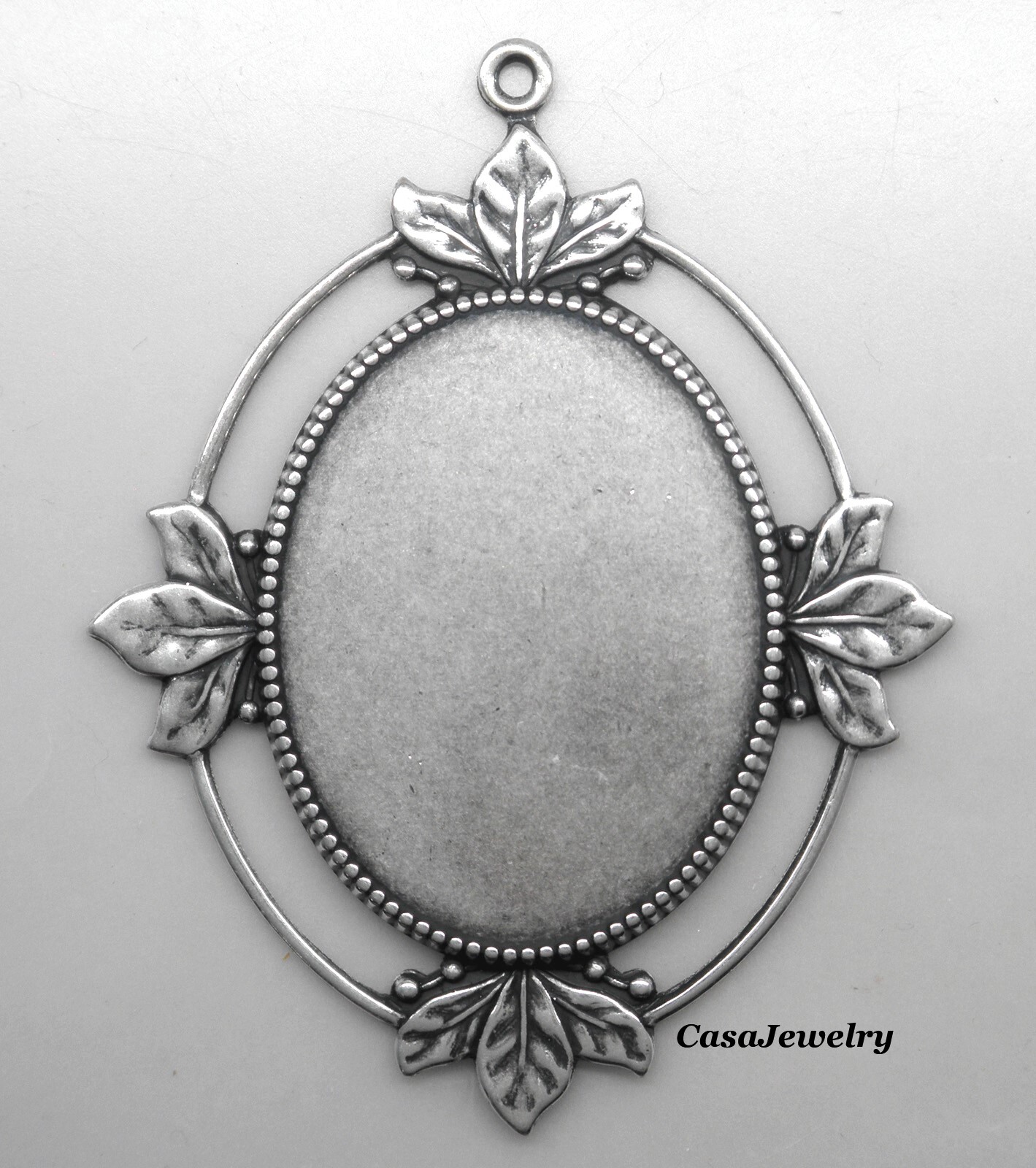 #1820 ANTIQUED STERLING SILVER PLATED 40×30 LEAF BORDER BEZEL W/TOP RING – 1 Pc