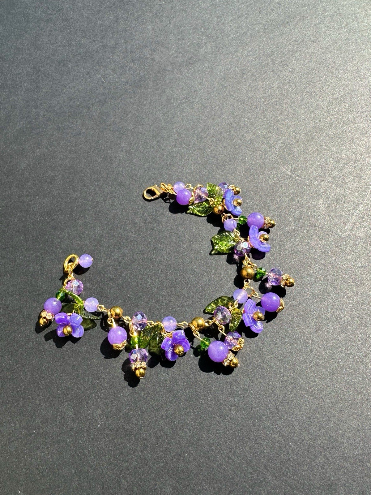 Gold Tone 7.5” Vintage Style – Green Leaf, Purple Flower Charm Bracelet.