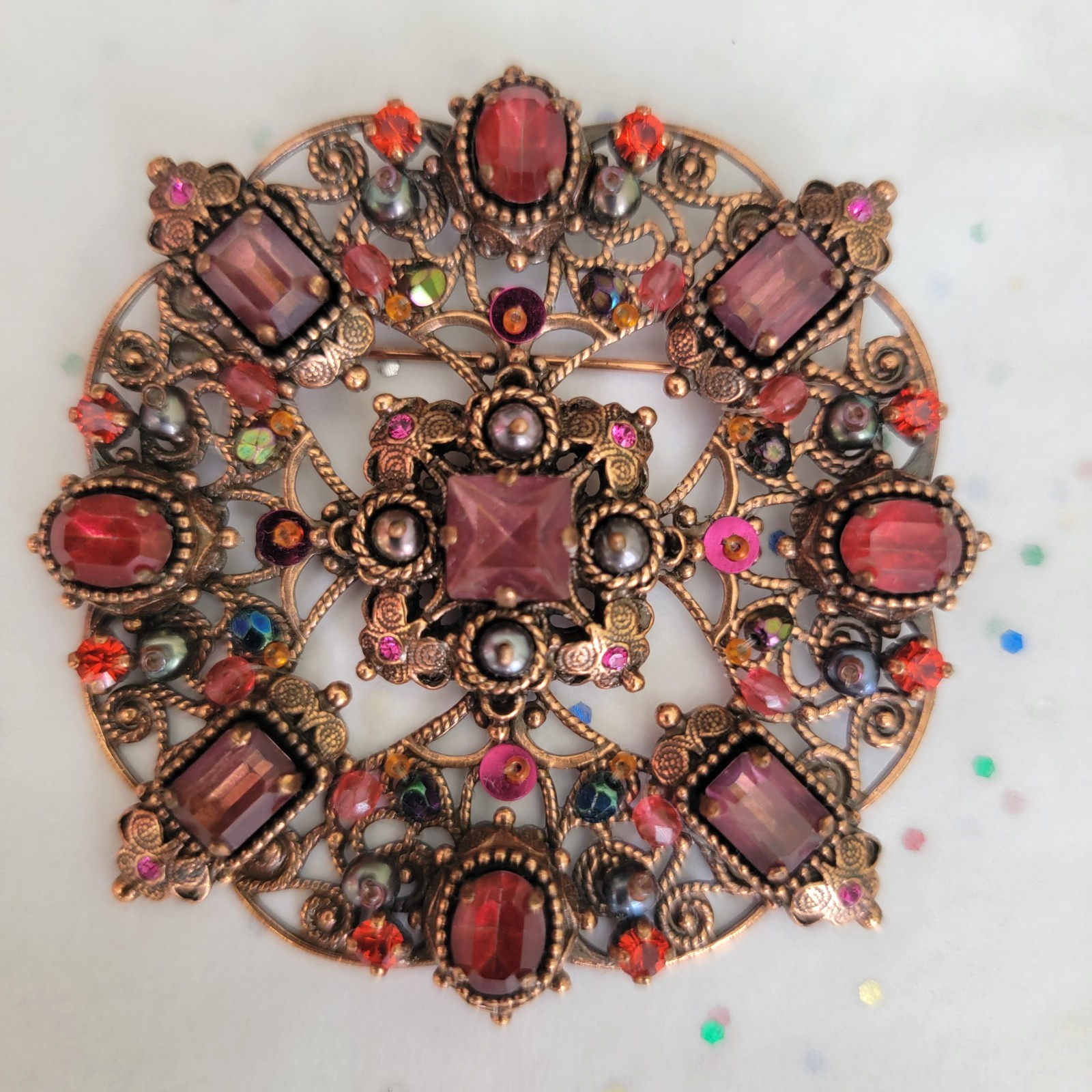 SATELLITE PARIS VINTAGE AMETHYST FACETED GLASS ON DETAILED COPPER BROOCH
