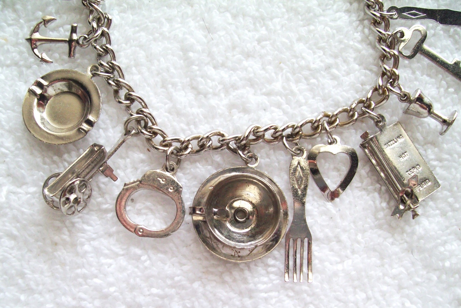 Vintage Coro Bright Silver-Tone Charm Bracelet with 15 Charms