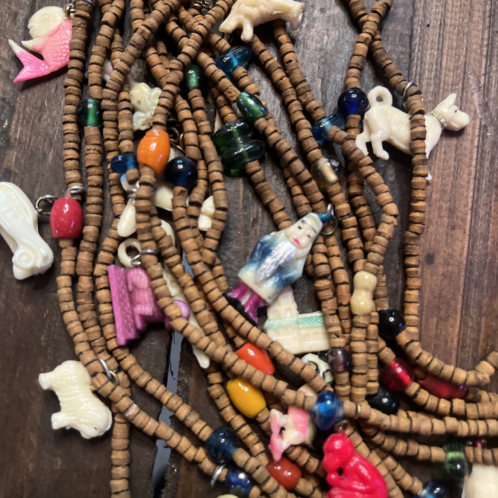 Vintage one of a kind wood bead Necklace w/ tons of celluloid charms unique cool