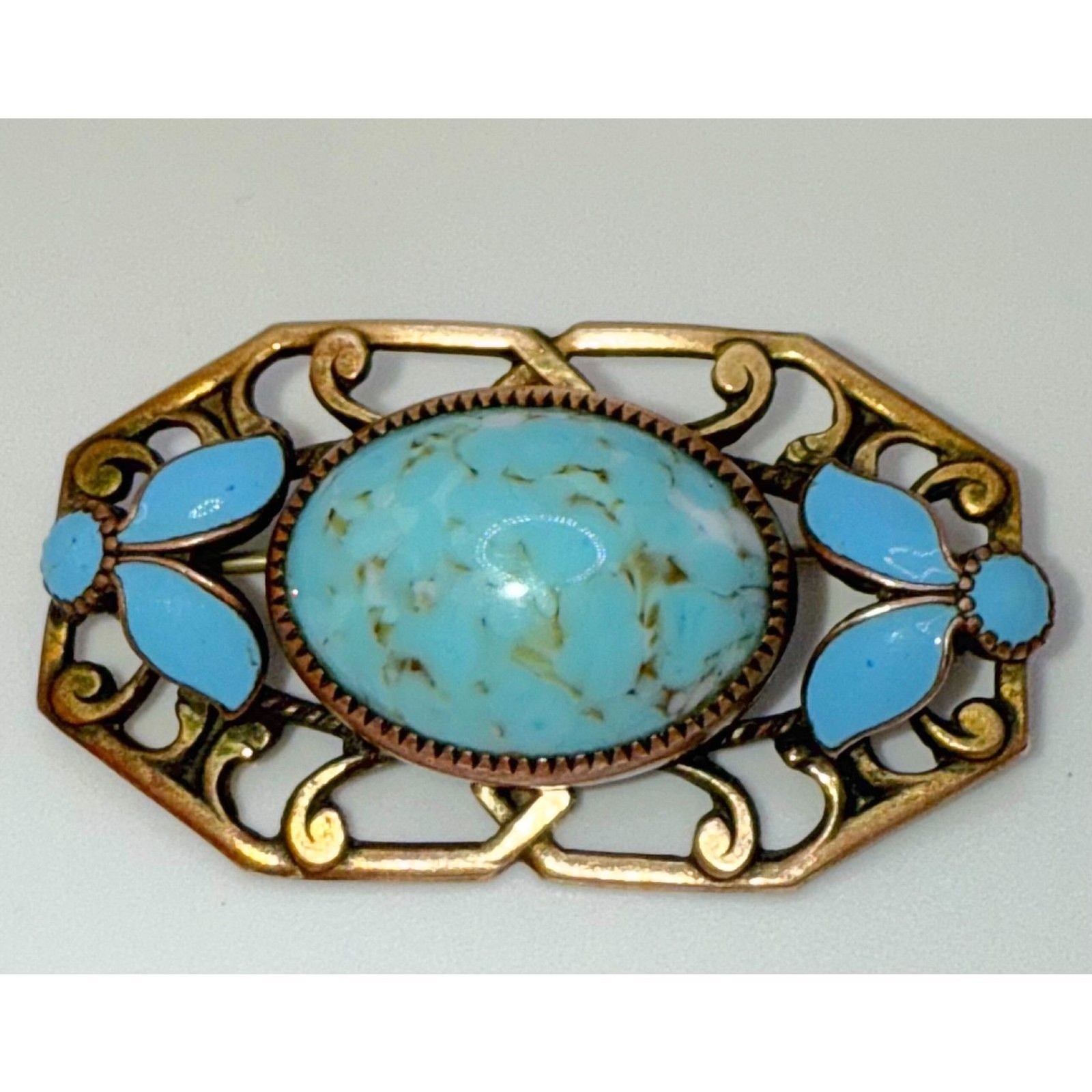 Turquoise brass brooch vintage source unknown