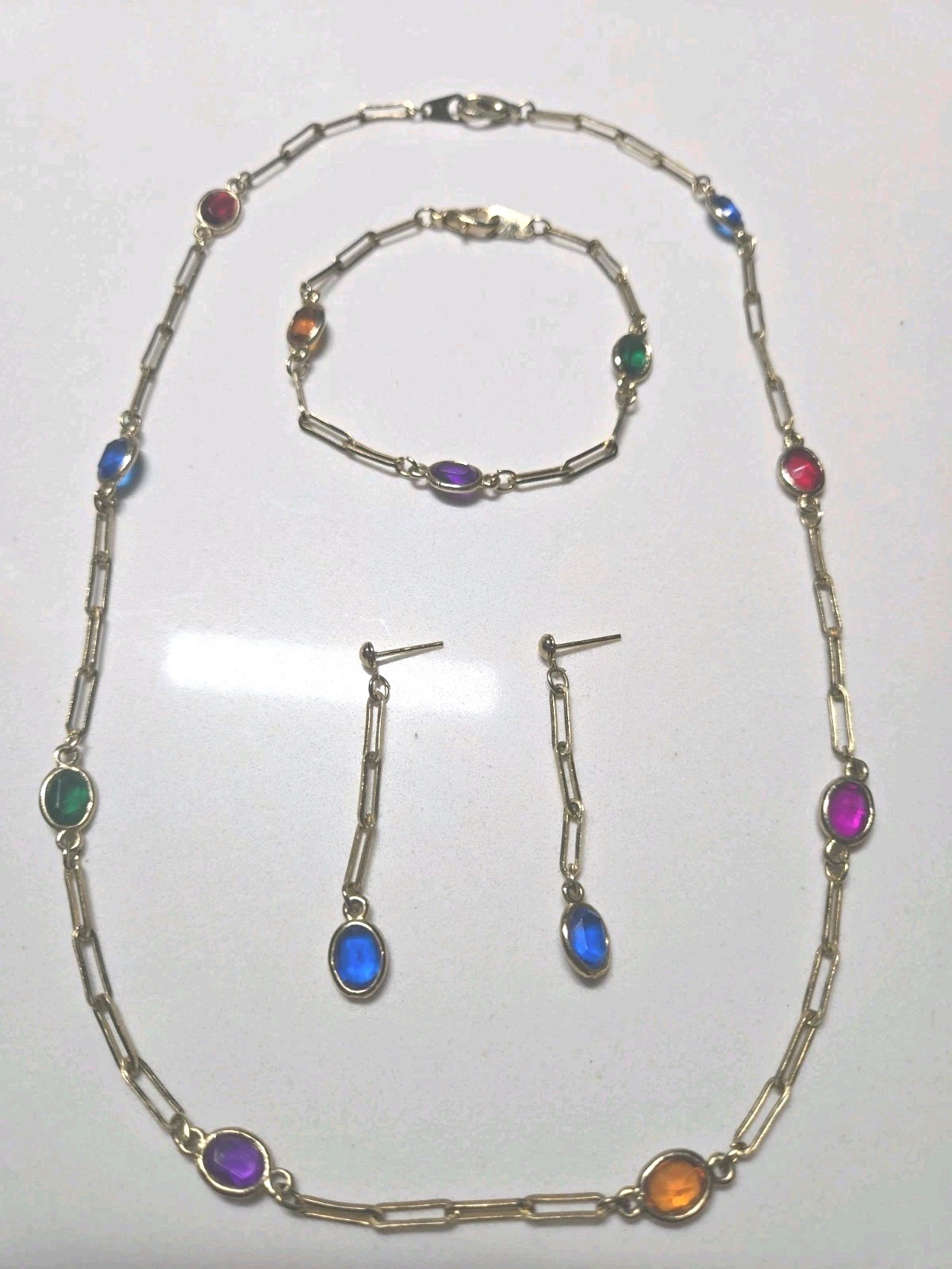 Mid Century 60′ 80′ gold-tone paperclip-style chainoval bezel-set colored Glass