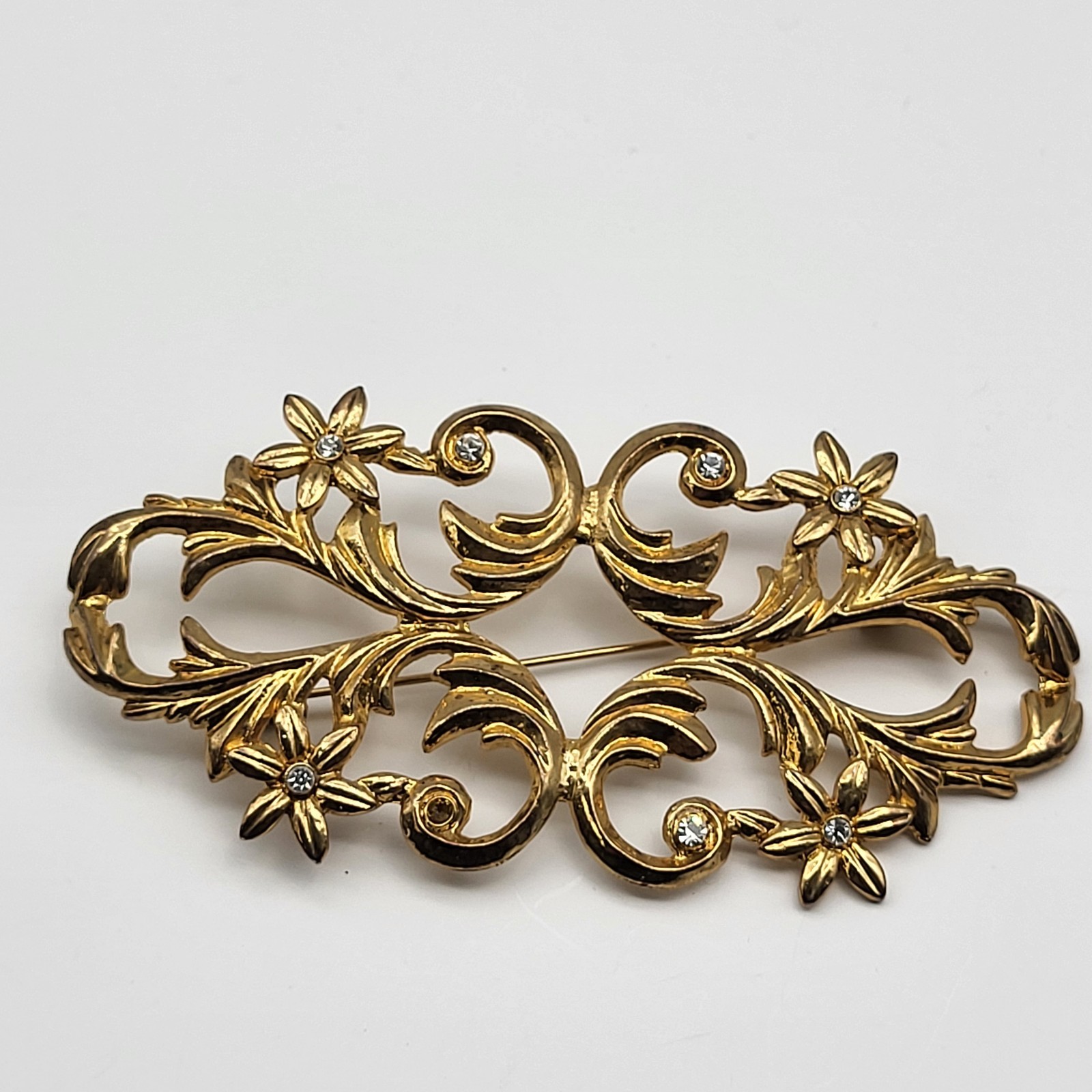 lovely vintage brooch pin elegant scrollwork rhinestone flower unsigned