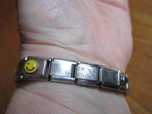 Stainless Steel Link Stretch Charm Bracelet Disney Lion King Diploma Flute Smile