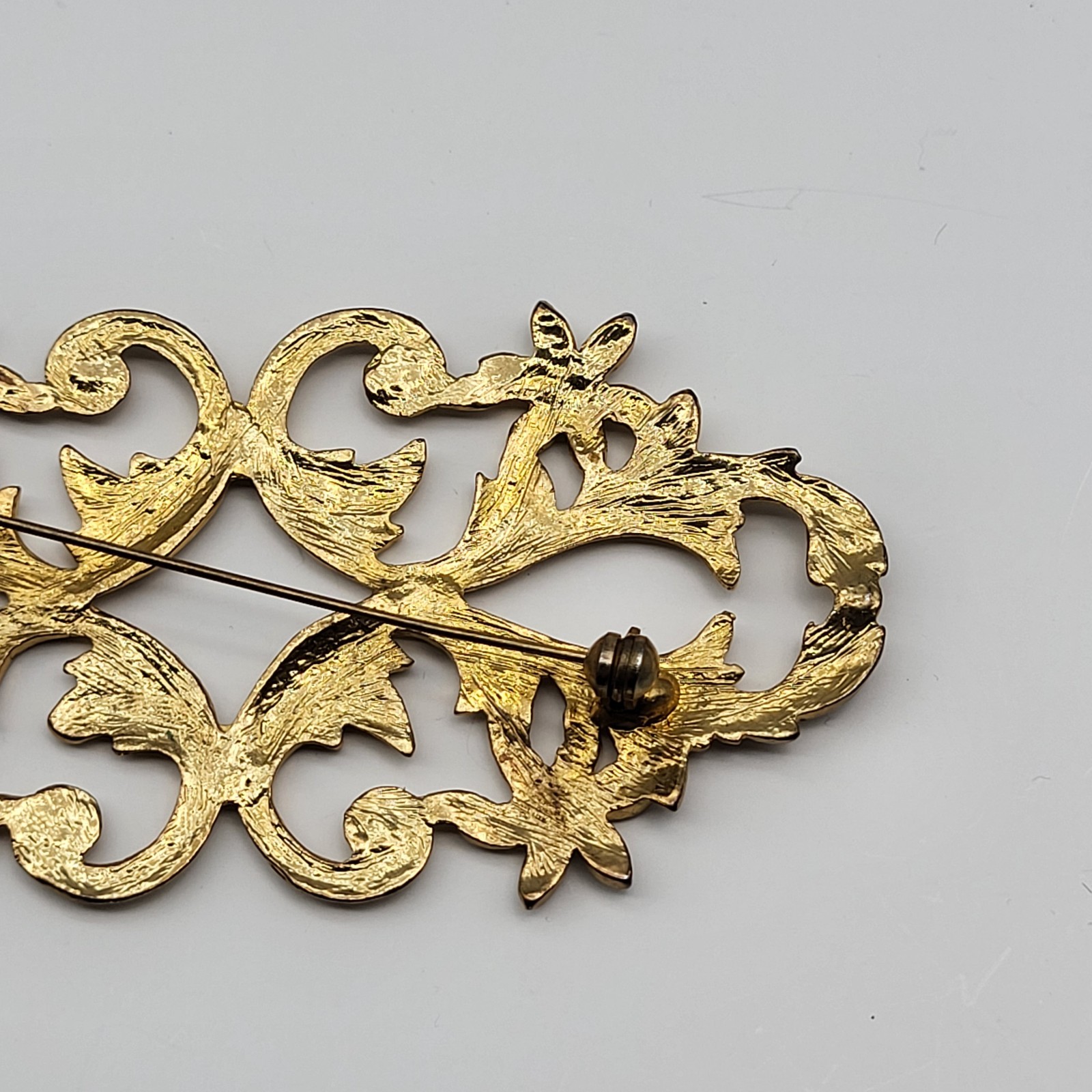 lovely vintage brooch pin elegant scrollwork rhinestone flower unsigned