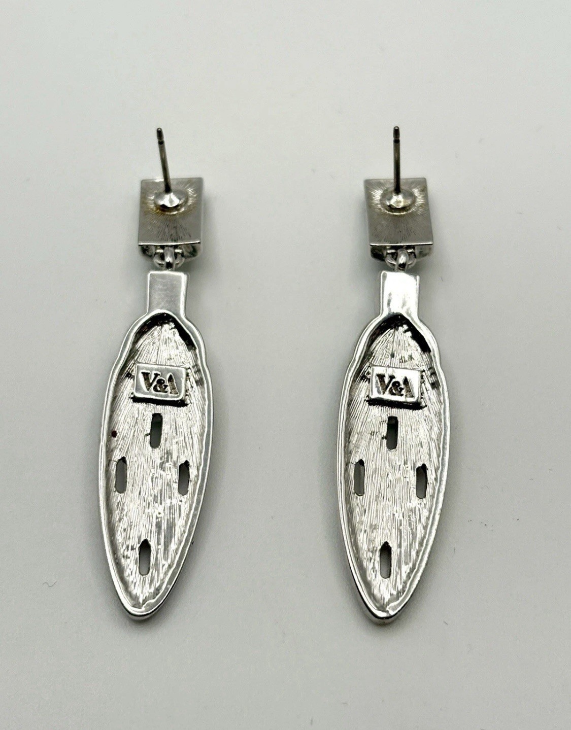 Vintage, circa unknown, designed earrings signed and designed by V&A Museum Shop