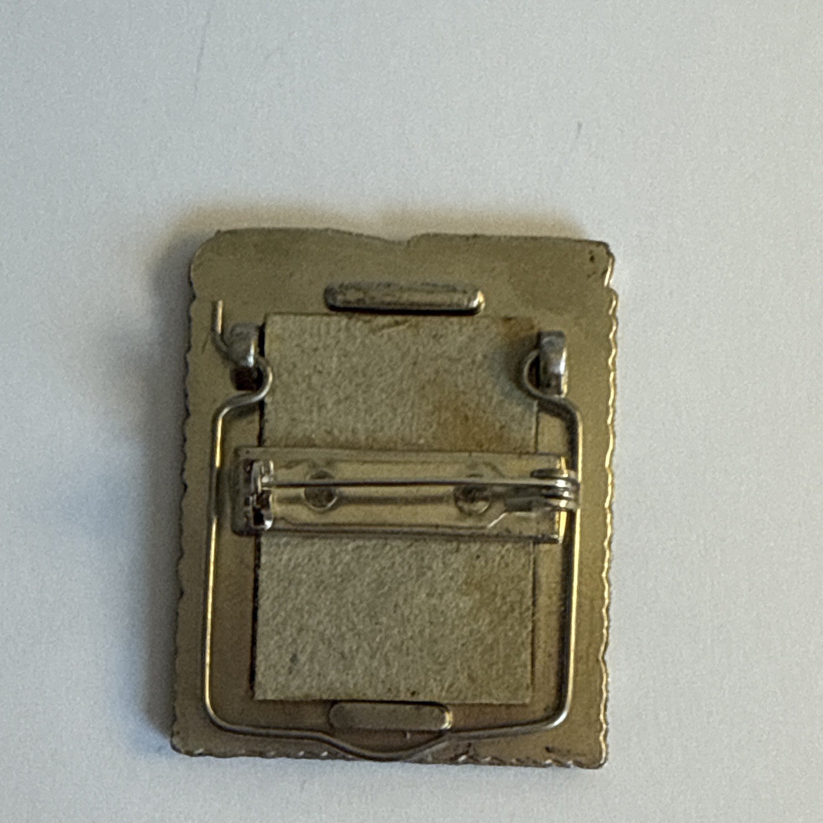vintage pewter grandma frame brooch features a decorative border of roses and he
