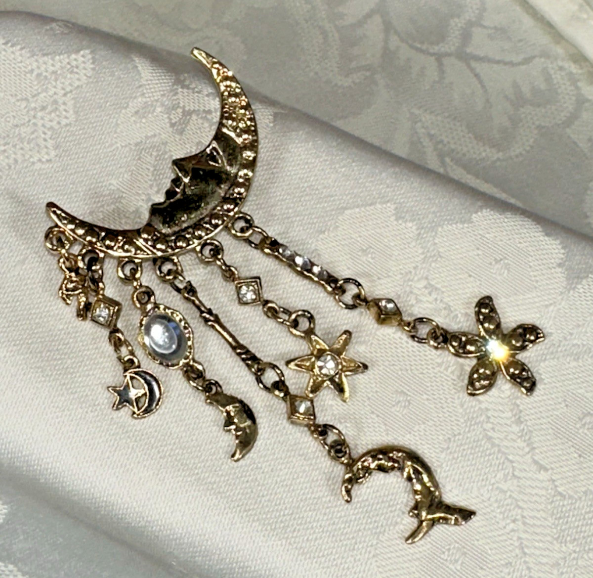 Gold Tone Crescent Moon With Dangling Stars, Cupid, Moon, Rhinestones Brooch