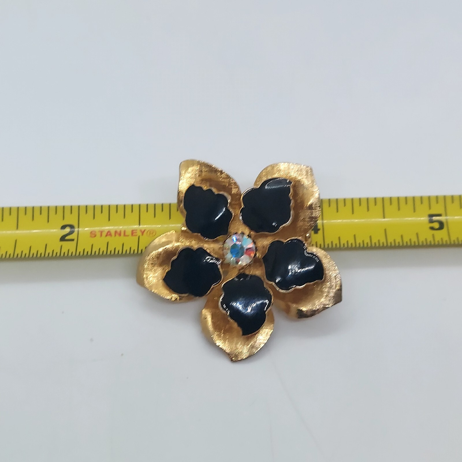 Vintage Gold Tone Black Enamel Flower Brooch With Aurora Borealis Rhinestone