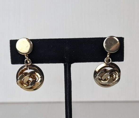 Vintage gold tone earrings knot design screw back