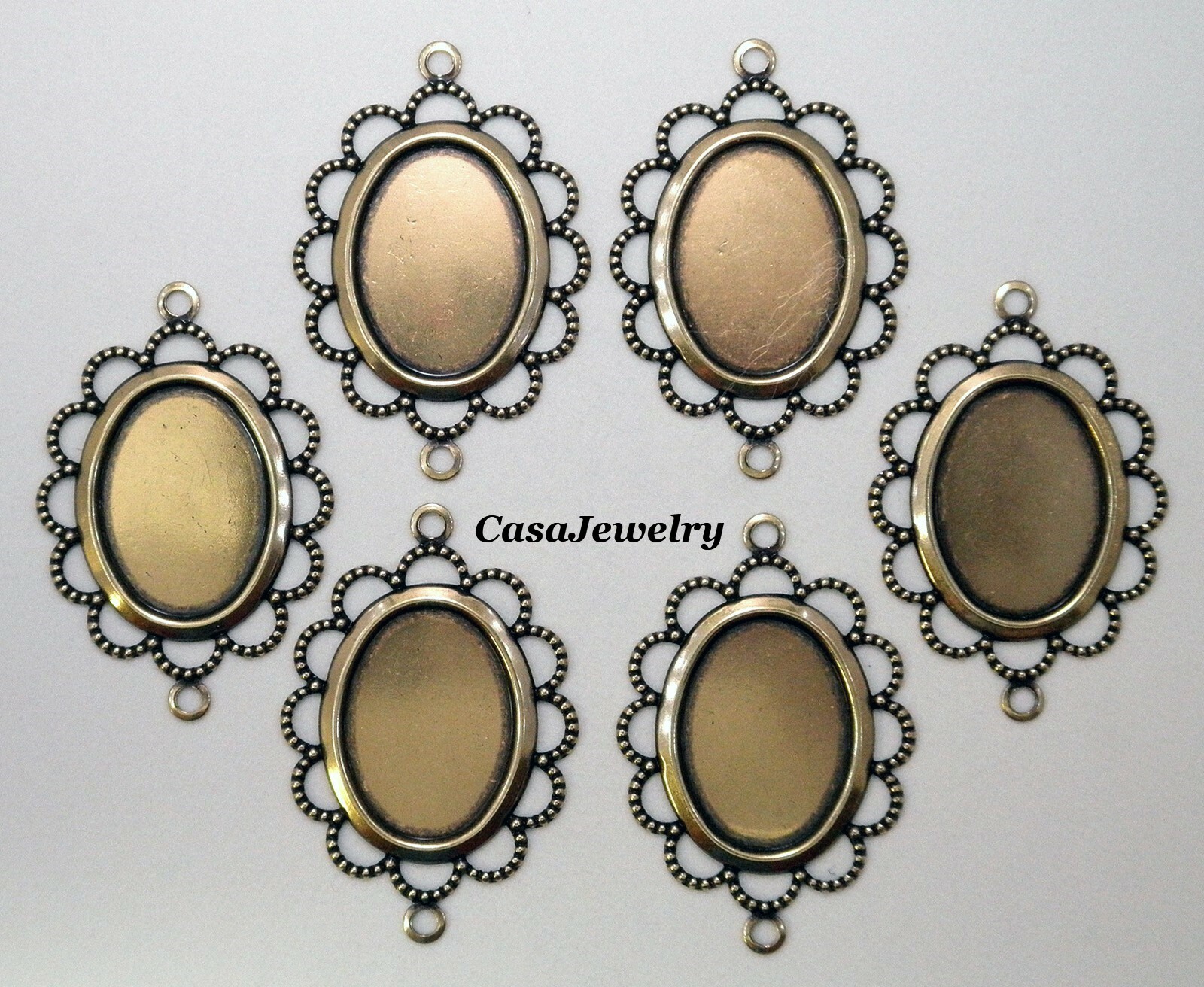 #3056 ANTIQUED GOLD FLAT LACY BORDERED 18×13 BEZEL W/2 HANG RINGS – 6 Pc Lot